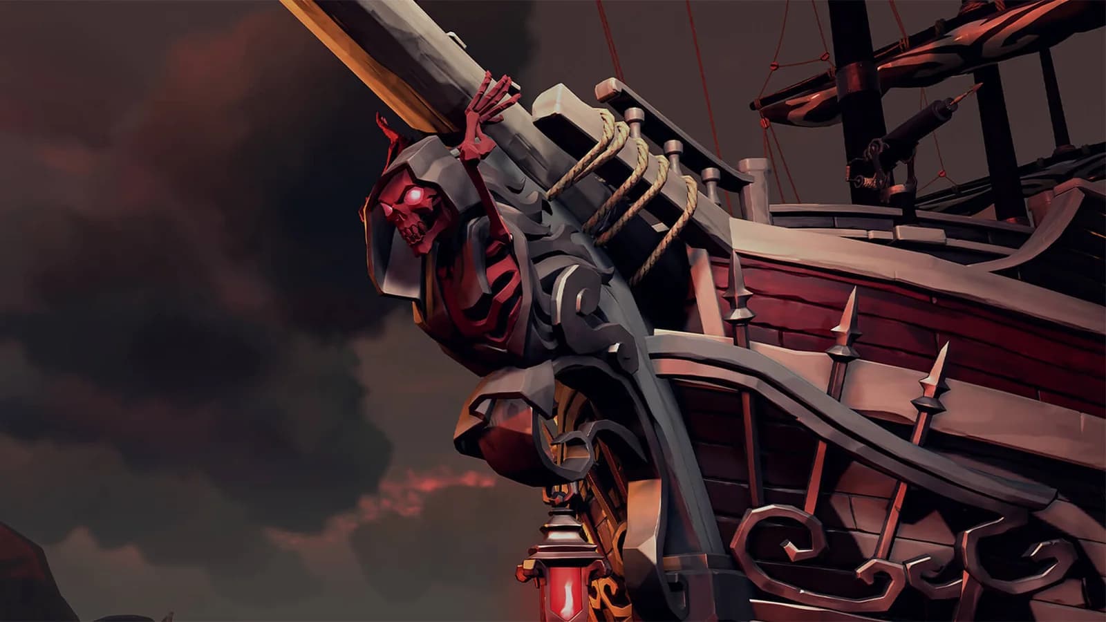 A close view of a Sea of Thieves cannon with a red skull decoration mounted on a dark wooden ship.